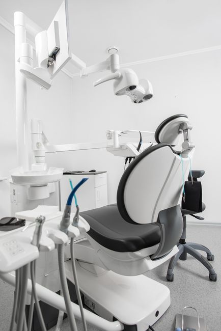 Dental care scene with a clinician attending to a patient